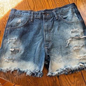Wrangler Rustler cut-off jeans.  Waist 35.  Distressing front & back.